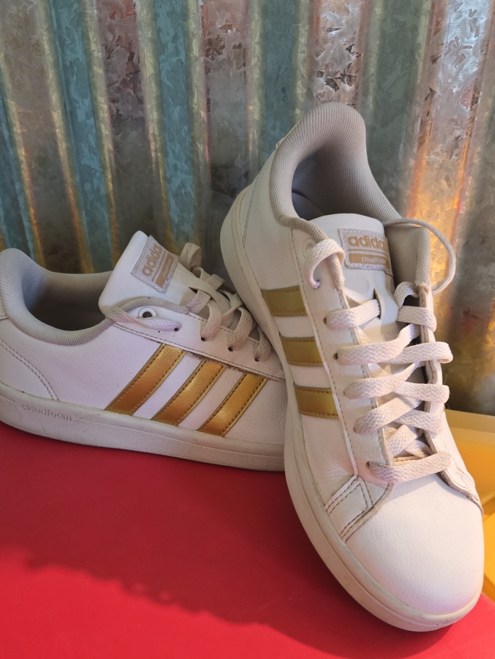 adidas White Sneakers with Gold Stripe Details